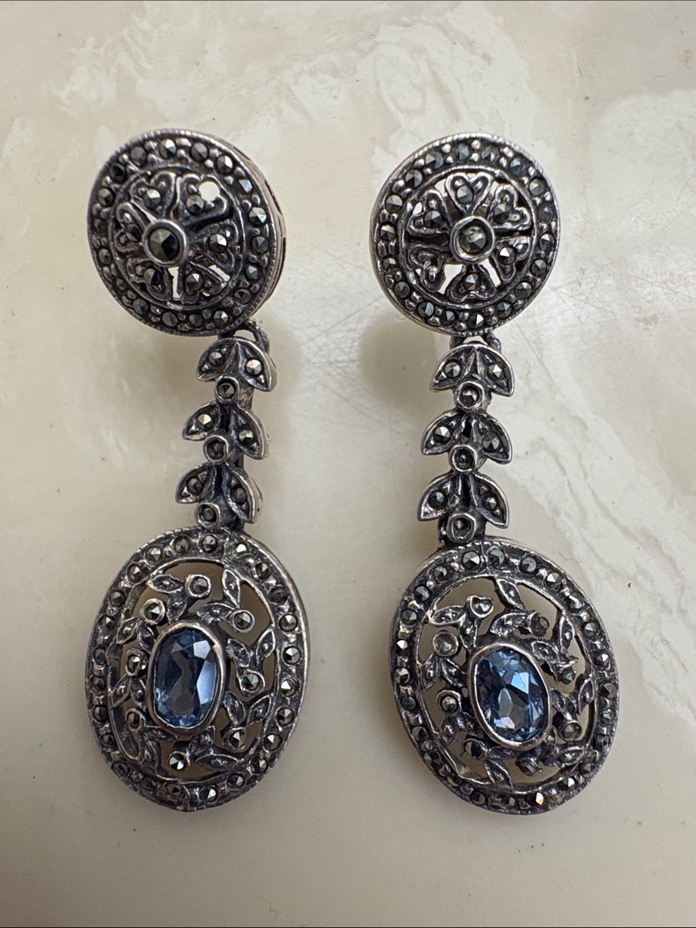 Sterling silver earrings with blue stone.